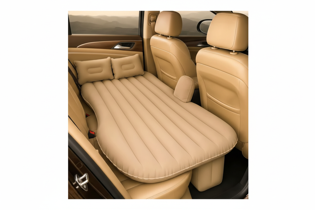 Side view of beige inflatable car bed with two pillows inside a car