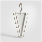 Close-up of the exact white plastic triangular 12-hook hanger organizer