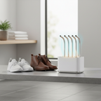 Electric shoe dryer beside everyday shoes in a laundry room